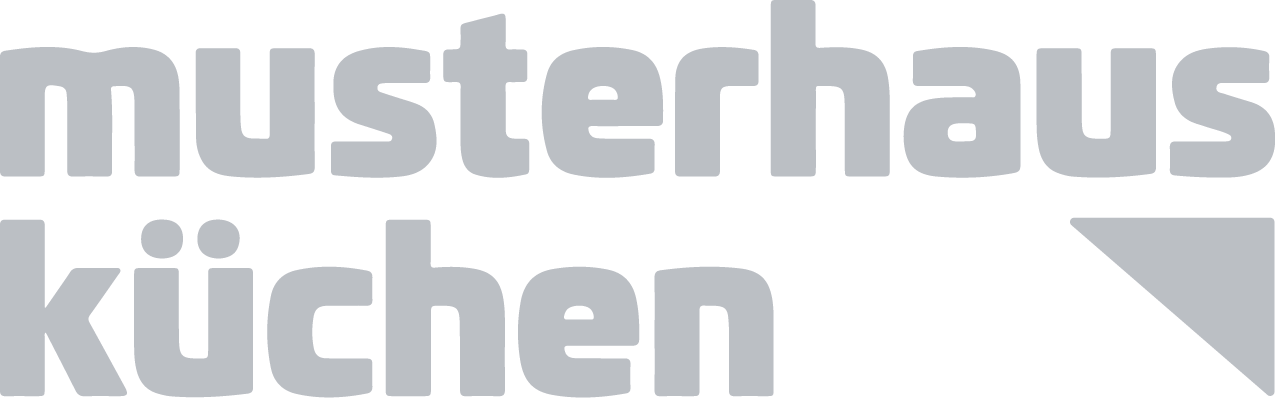 Graues Logo mit dem Text "musterhaus küchen" in zwei Zeilen, schlicht und modern gestaltet.