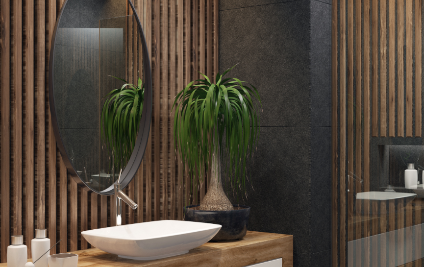 Modernes Badezimmer mit ovalem Spiegel, Holzablage, Waschbecken, Pflanzen und sanfter Beleuchtung.